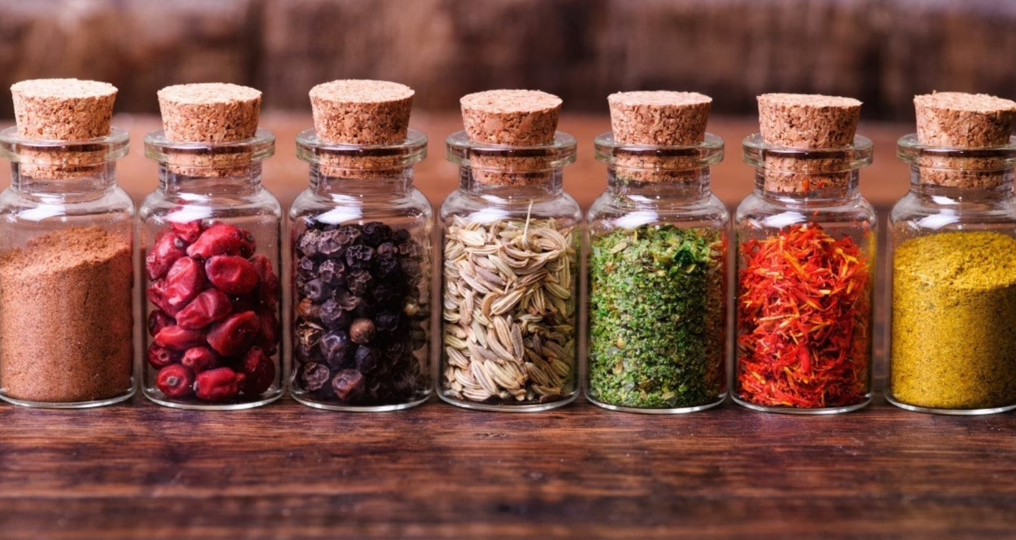 Spice jars and kitchen accessories neatly arranged on a countertop