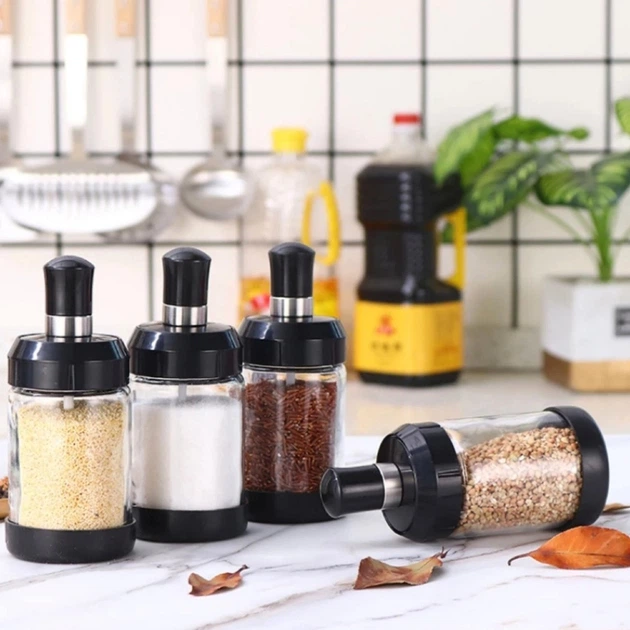 Spice jars neatly arranged in a warm kitchen setting