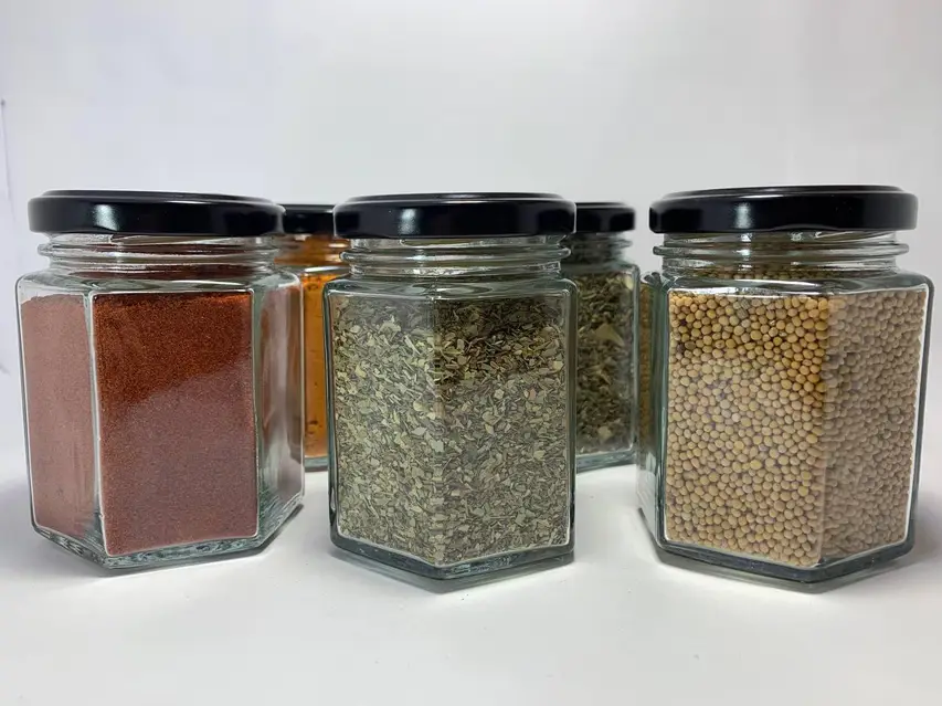 Wooden pepper mills on a kitchen worktop