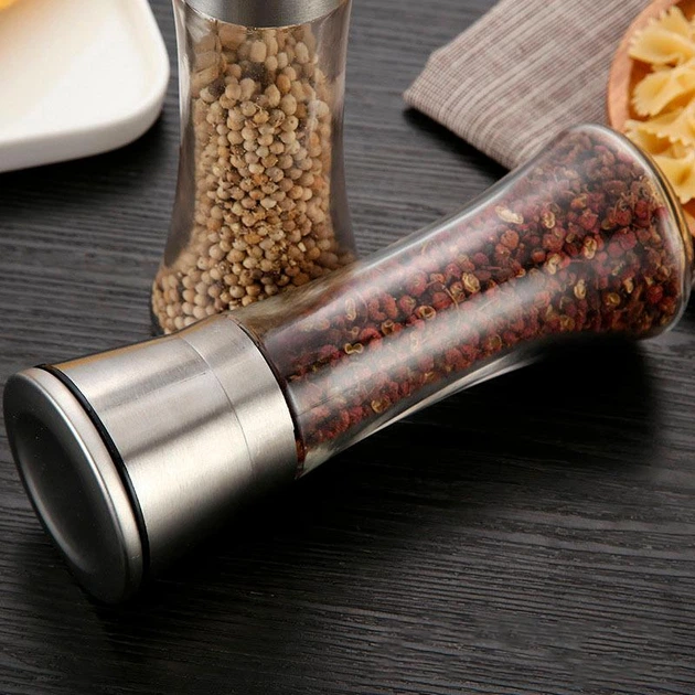 Colourful spices in glass containers with cork lids